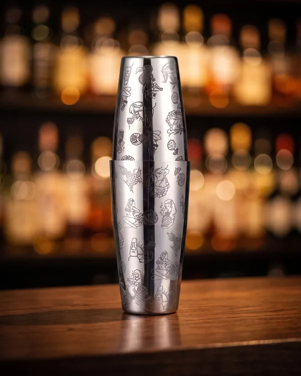Silver engraved Boston shaker, Hula pattern, on a bar counter