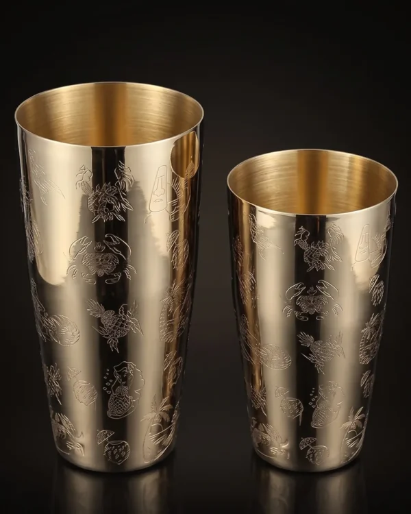 Gold engraved Boston shaker, Hula pattern, three-quarter view