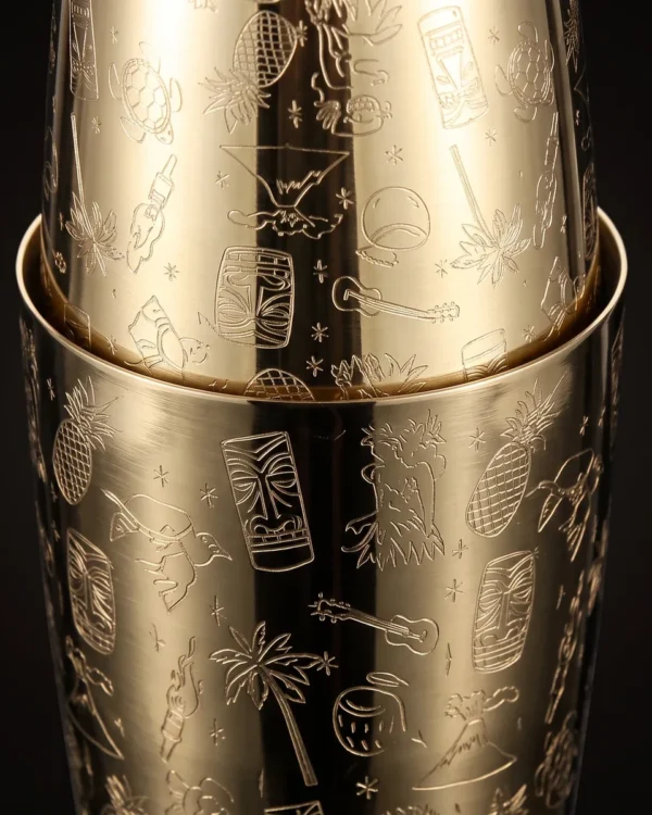 Gold engraved Boston shaker, Tiki pattern, three-quarter view