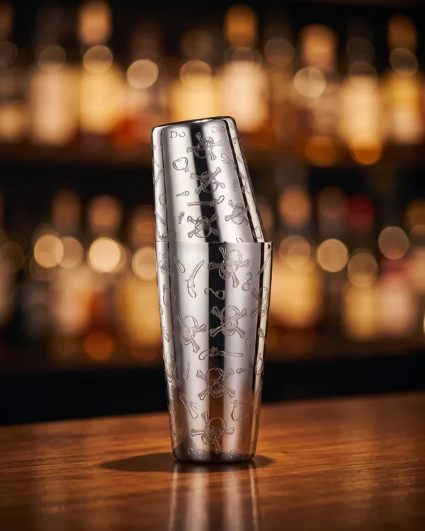 Engraved Boston shaker, skull pattern, on a bar counter