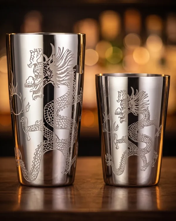 Engraved Boston shaker, Dragon pattern, on a bar counter