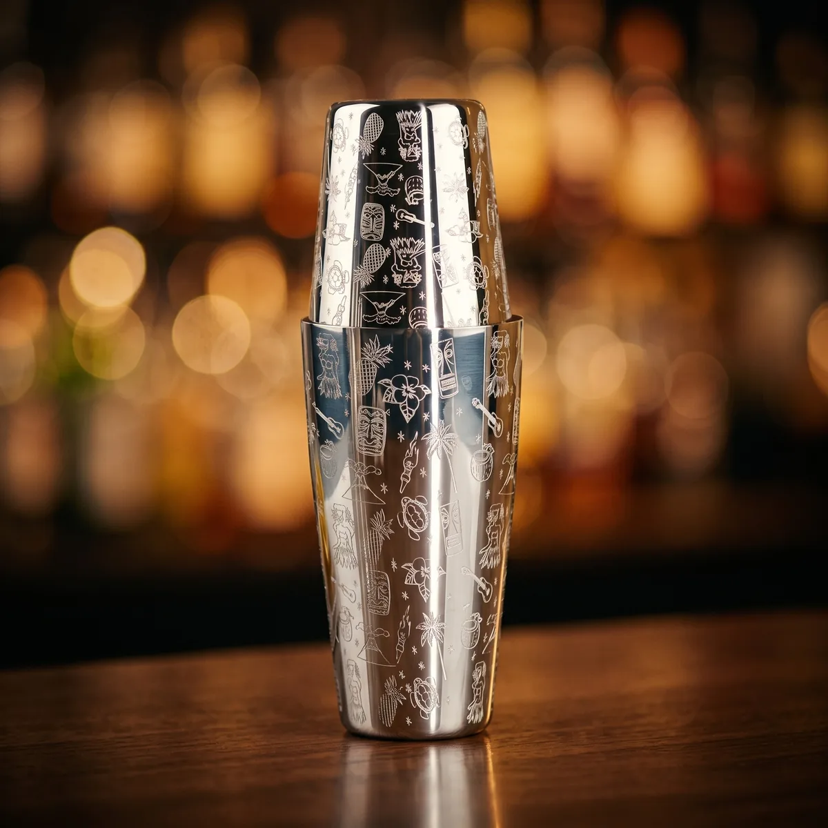 Engraved Boston shaker, Hawaiian pattern, on a bar counter