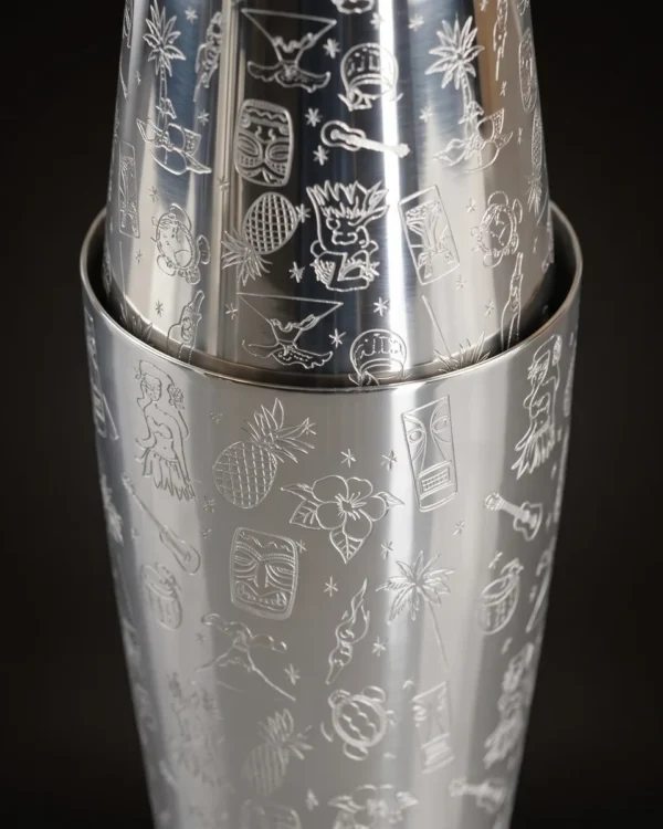 Engraved Boston shaker, Hawaiian pattern, three-quarter view