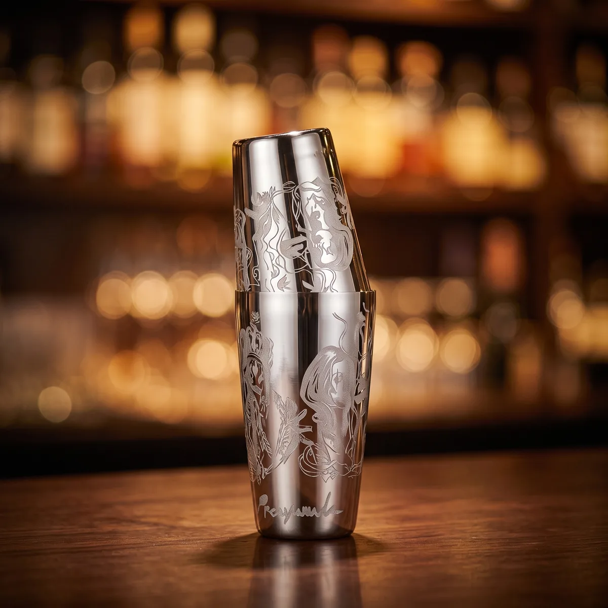 Engraved Boston shaker, Viking queen pattern, on a bar counter