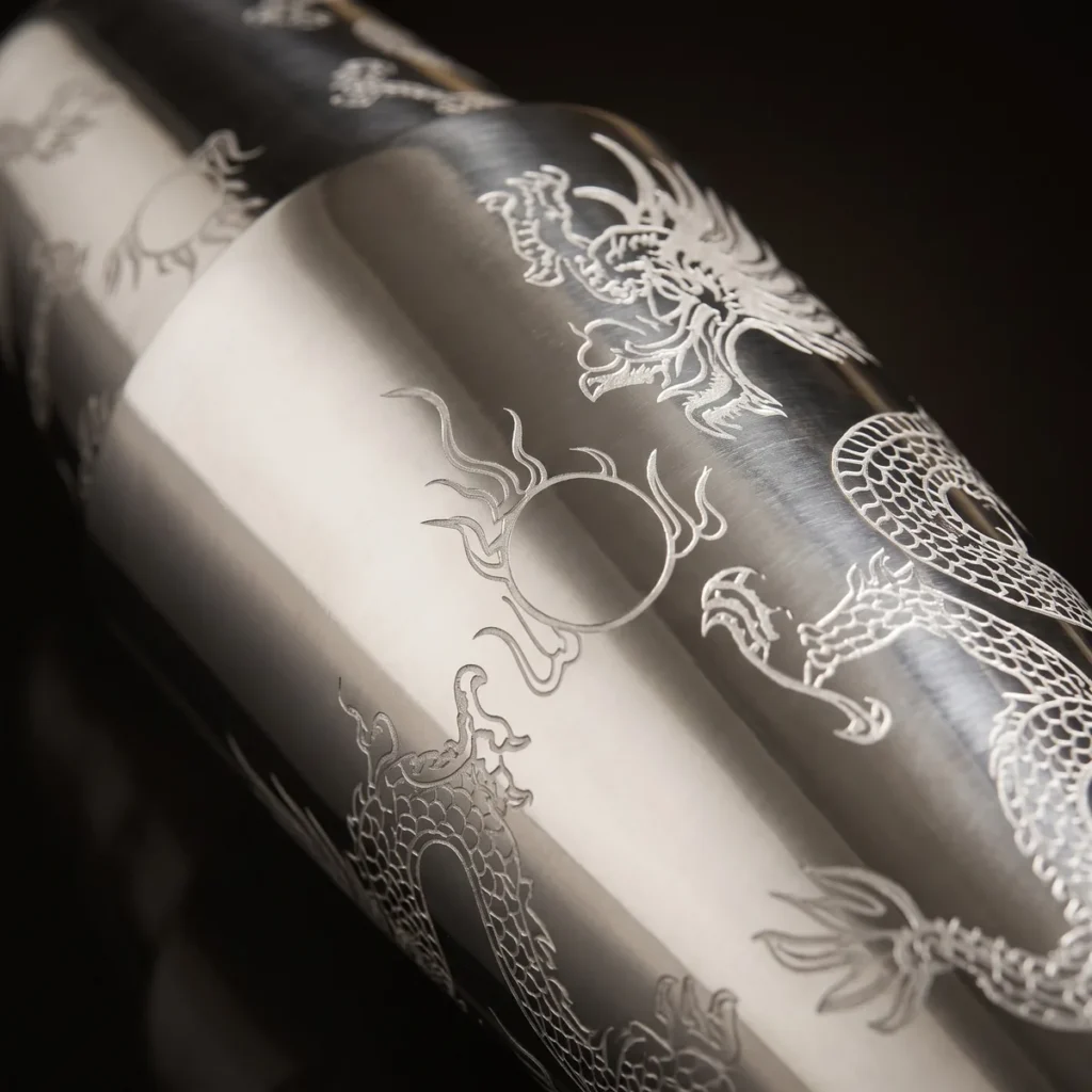 Finely engraved Boston shaker, dragon pattern, three-quarter view