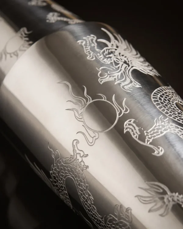 Finely engraved Boston shaker, dragon pattern, three-quarter view