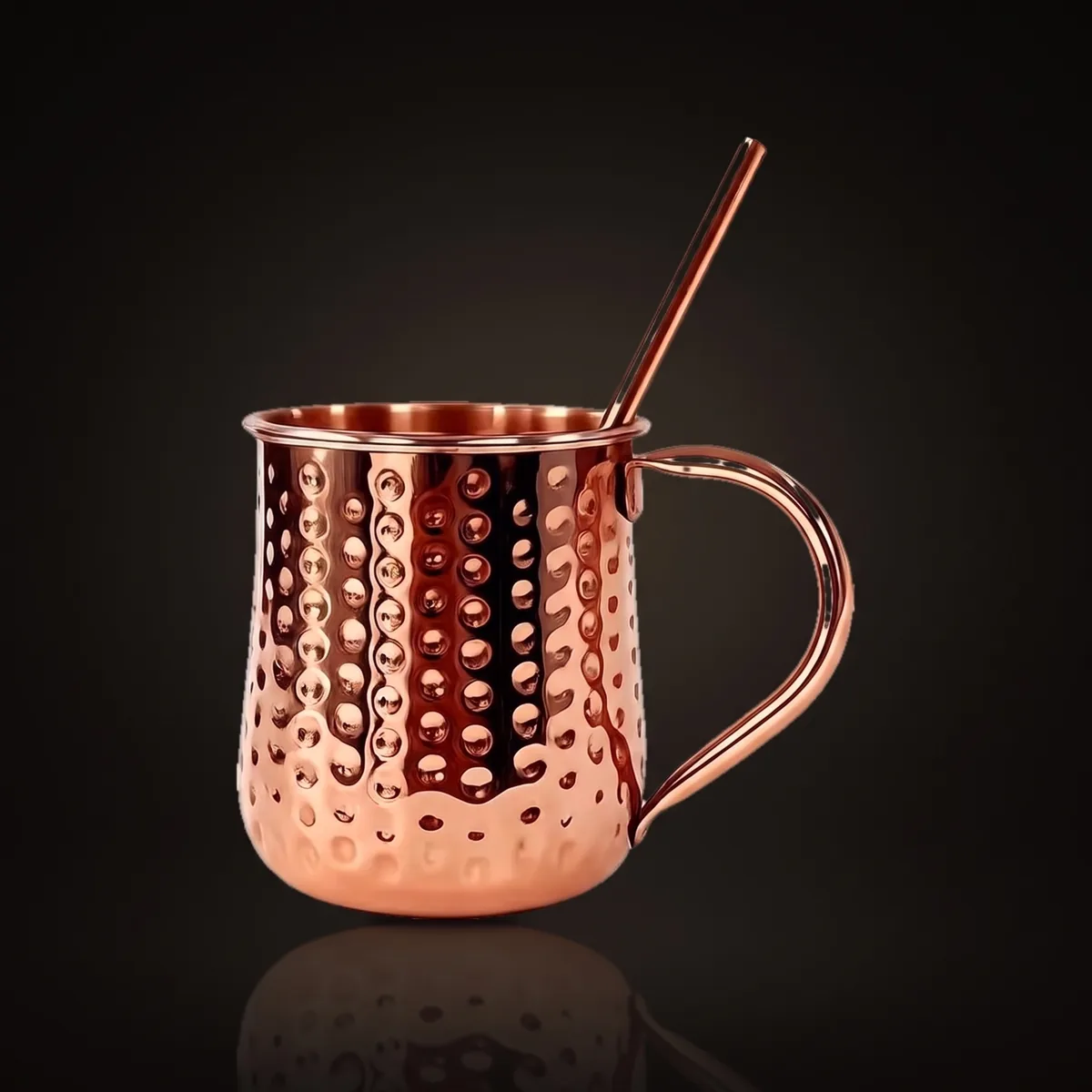 Hammered copper Moscow Mule mug with straw, front view