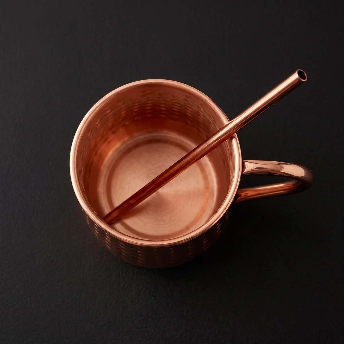 Hammered copper Moscow Mule mug with straw, top view