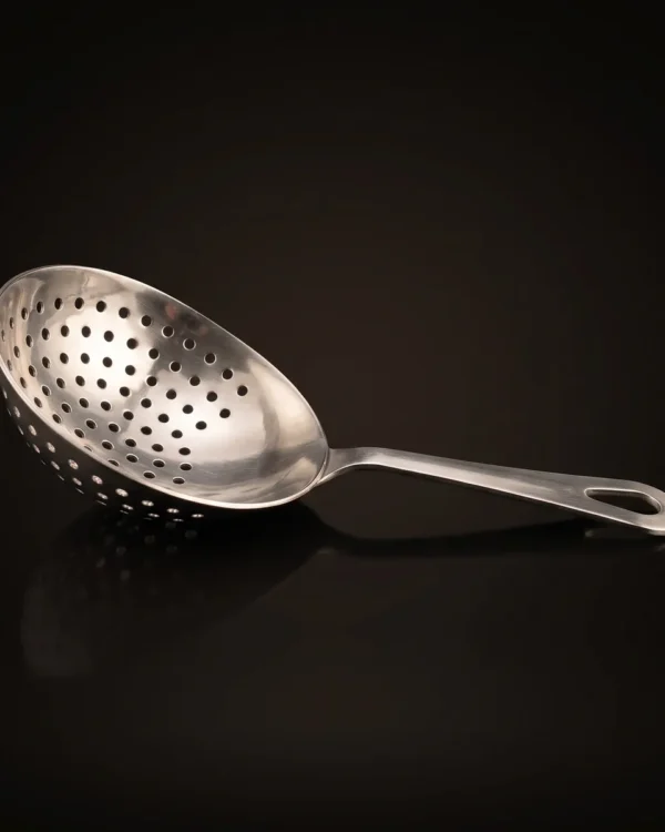 Stainless steel julep strainer, three-quarter view
