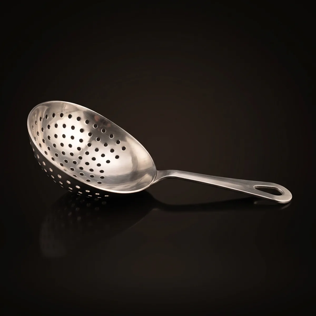 Stainless steel julep strainer, three-quarter view