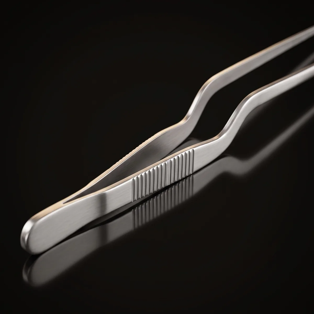 Stainless steel garnish tongs 14 cm, three-quarter view