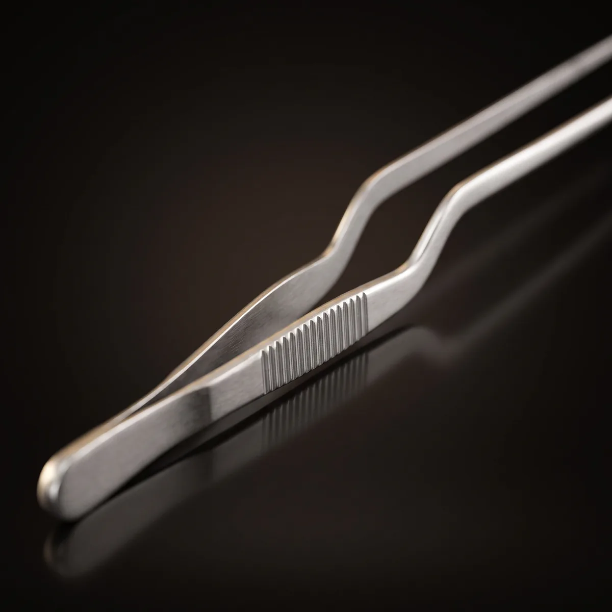 Stainless steel garnish tongs 26 cm, three-quarter view